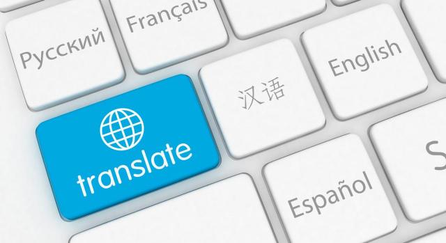 Nuevas traducciones de contabilidad según las NIIF disponibles en español. Imagen de teclado con palabras en las teclas y una en azul con la palabra translate